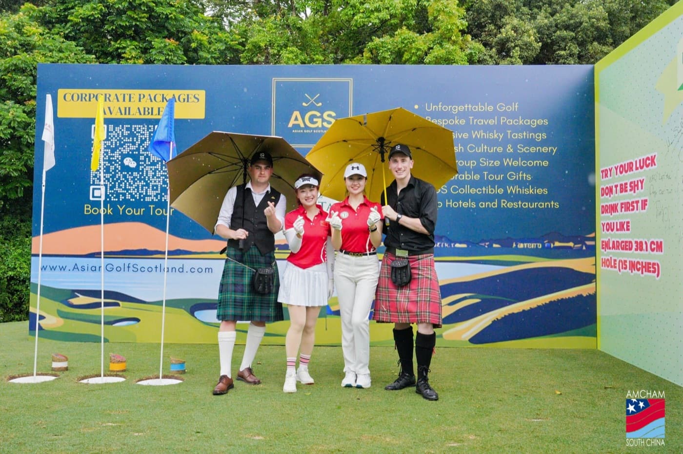 The AGS stand with hosts in Highland dress