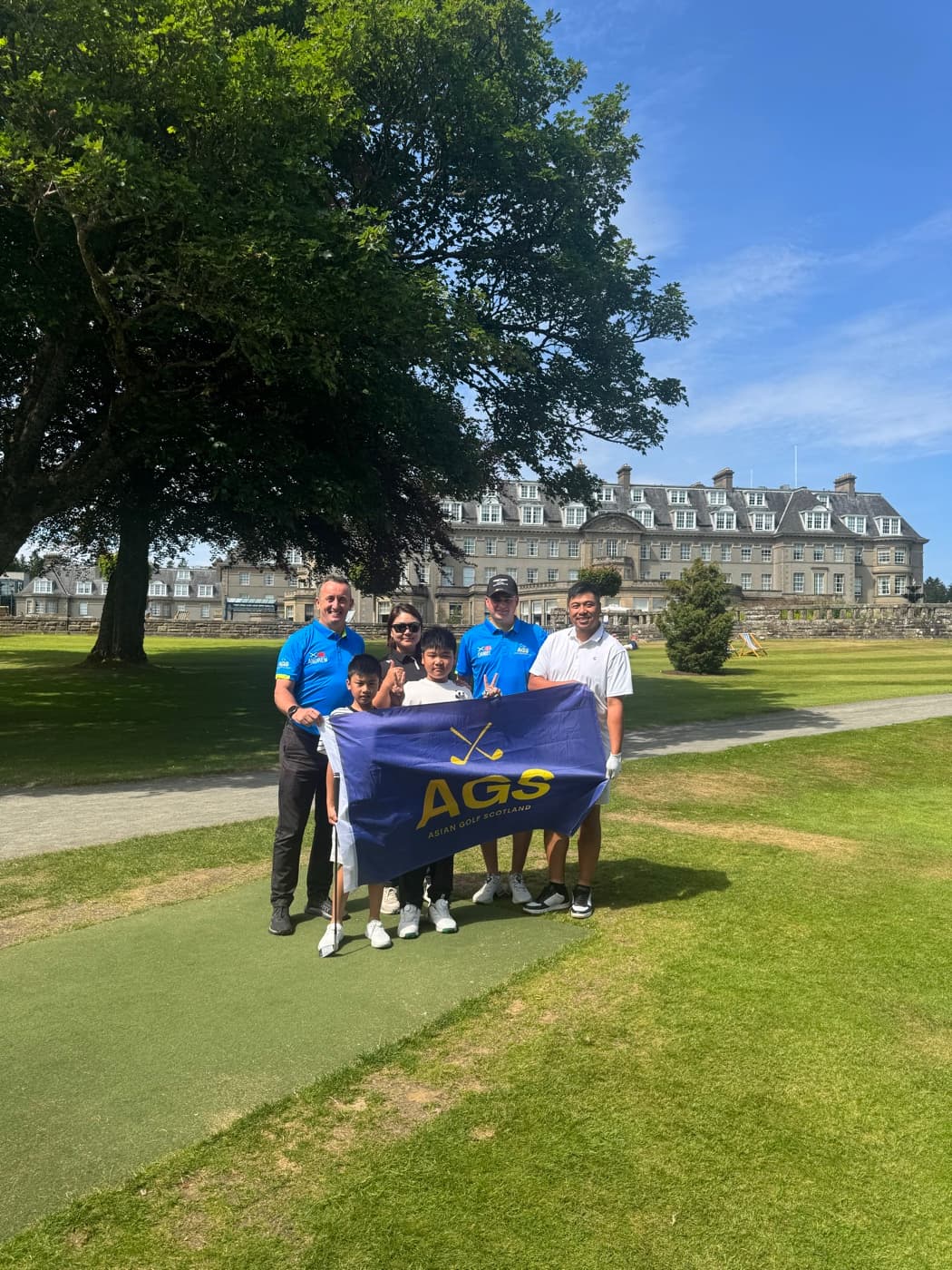 AGS guests with the flag by a Scottish estate