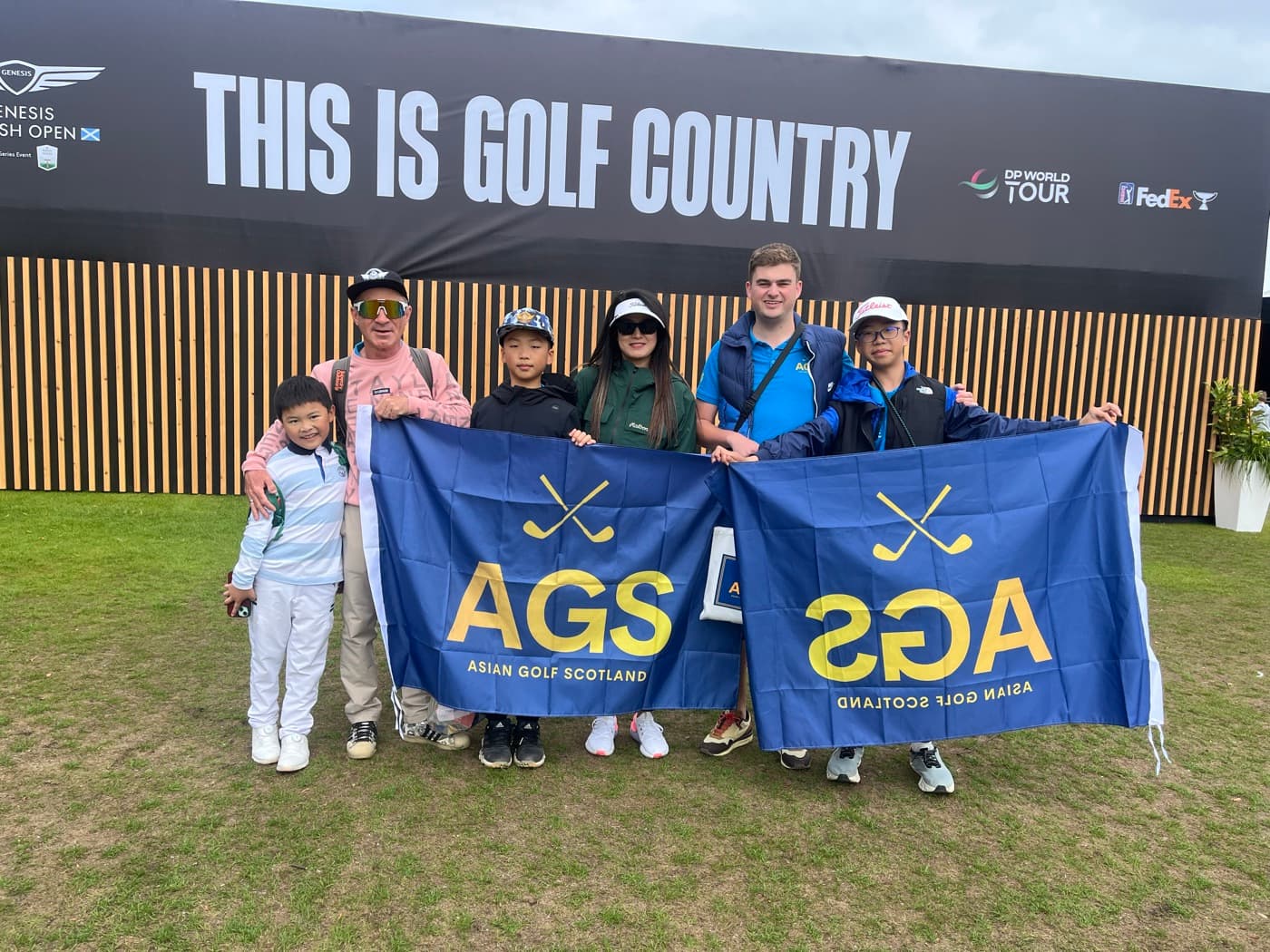 Young players with AGS flags at a PGA Tour venue